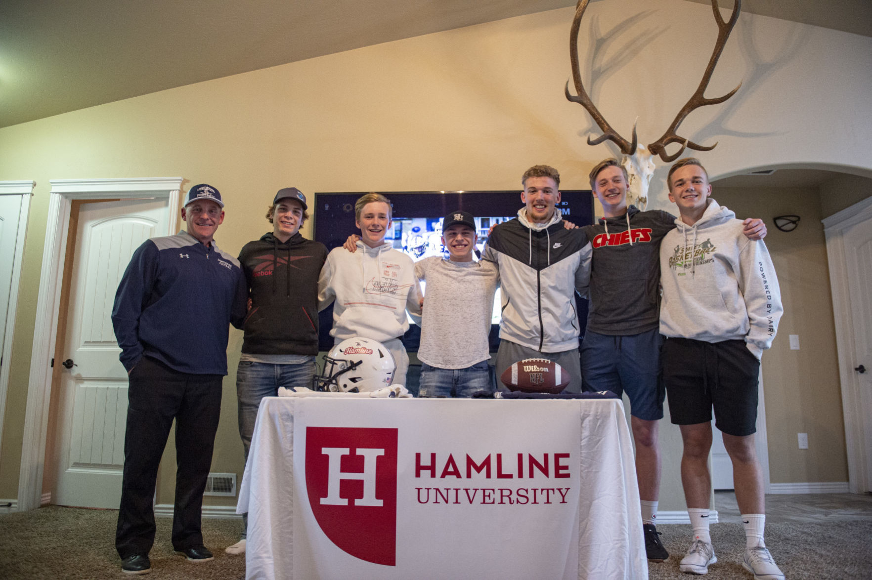 Lighthouse grad signs with Hamline University